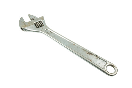 Old adjustable wrench isolated on white backgroundの写真素材