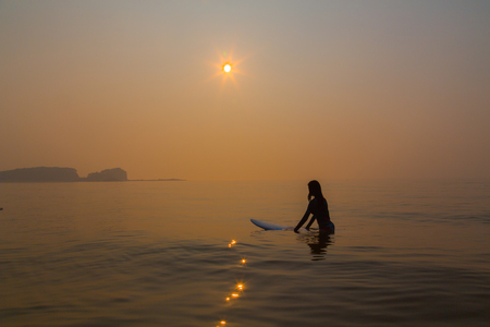 Surfer on sunsetの写真素材