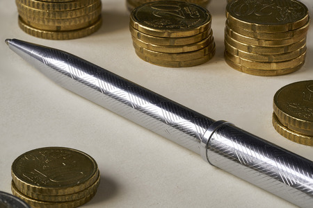 close up pen with euro coinの写真素材