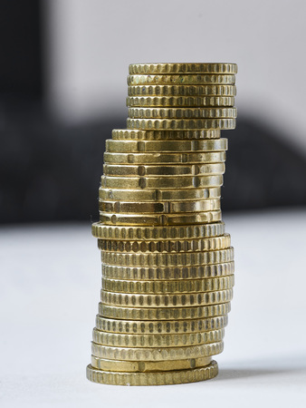 the gold coing stack up with white backgroundの写真素材