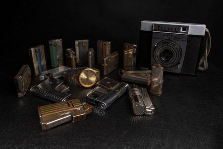 Old vintage camera on a black background with different types of equipment.の写真素材