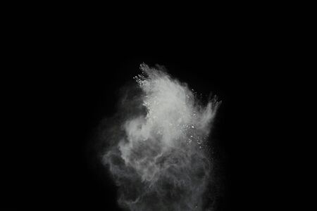 White powder explosion isolated on black background.の写真素材