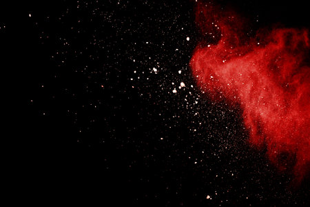 Abstract Red powder splatted background,Freeze motion of red powder exploding/throwing green dust.