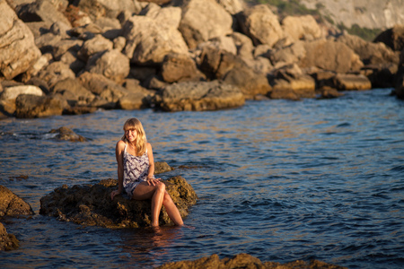 Girl on the water at the seashoreの写真素材