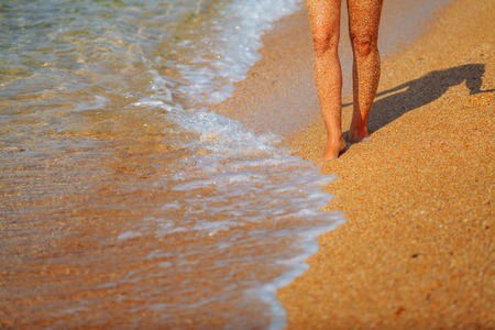 Feet girl on the beachの写真素材