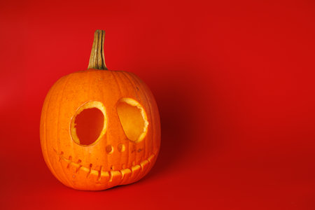 Empty Pumpkin head on red background. Halloween holiday conceptの写真素材
