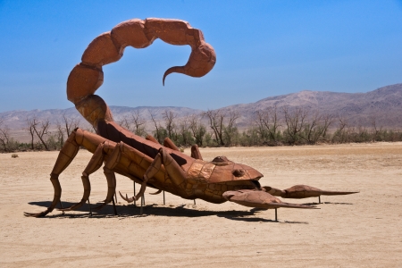 Borrego Springs, California - June 25, 2012 Artist Ricardo A  Breceda has added a Scorpion vs  Grasshopper sculpture to the collection of prehistoric animals on permanent display at Galetta Meadows のeditorial素材