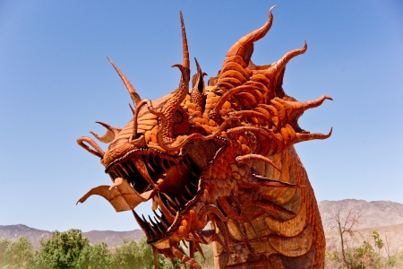 Borrego Springs, California - June 25, 2012  Artist Ricardo A  Breceda displays a 350-foot long Serpent sculpture at the collection of prehistoric animals on permanent display at Galetta Meadows のeditorial素材