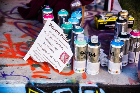 Las Vegas, Nevada USA - January 20, 2013  A warning sign alerts taggers and graffiti artists that painting buildings without premission is illegal のeditorial素材