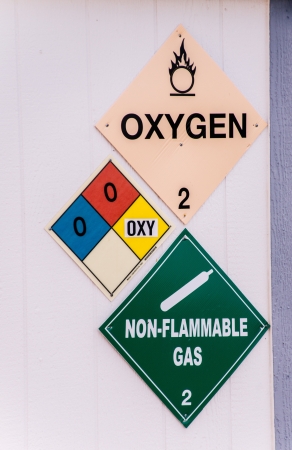 Warning signs alert workers to the presence of oxidizing chemicals in the workplace の写真素材