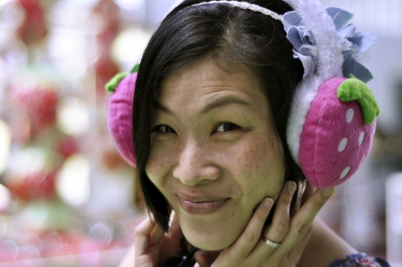 Beautiful Asian girl smiling at cameraの素材