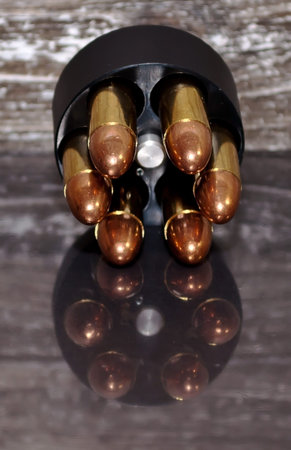A speed loader for a revolver, for either a 357 magnum or a 38 special. It is fully loaded with full...