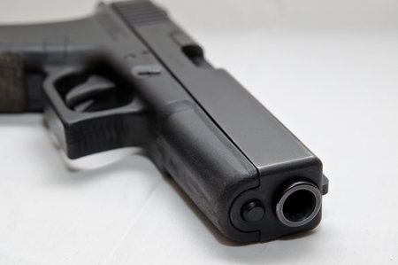 A black semi automatic 40 caliber pistol on a white background