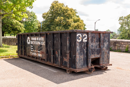 Pittsburgh, Pennsylvania, USA 6/21/20 A black colored privately owned 30 yard dumpster in a parking...