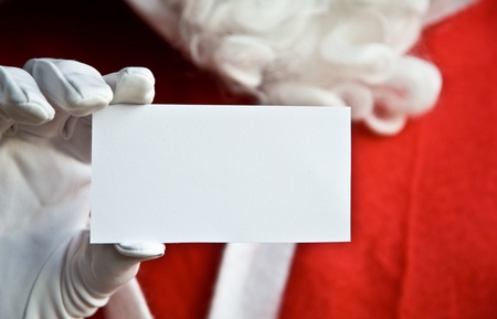 Father Christmas with clear white card for textの写真素材