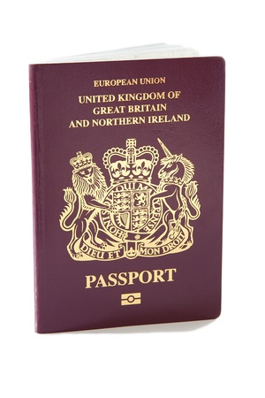 A United Kingdom passport against a plain white backgroundの写真素材