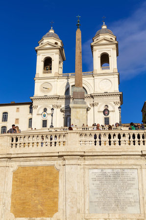 ROME, ITALY - OCTOBER 25, 2019: View from Spanish Steps at the church of the Santissima Trinita dei Monti and the Obelisco Sallustiano on blue sky background in Rome, Italyのeditorial素材