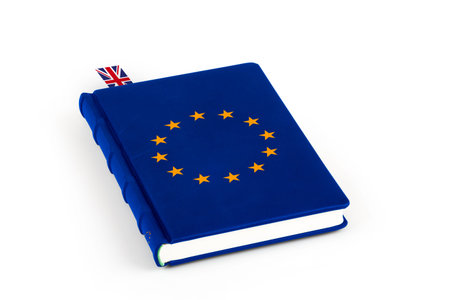 Blue book with European Union flag stars and inserted bookmark with Great Britain flag isolated on...