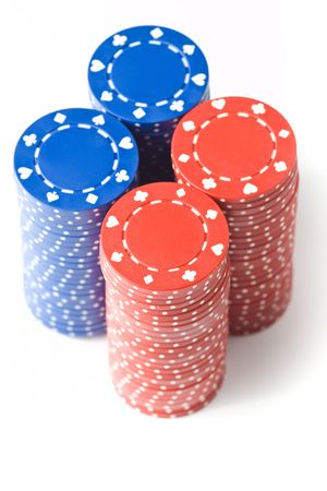4 stacks of blue and red poker chips, isolated on whiteの写真素材