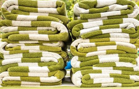 white and green towels on swimming poolの写真素材