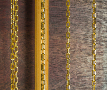 golden chains of pendulum clockの写真素材
