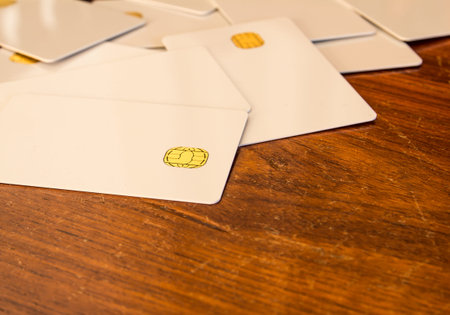 new blank of chip cards on wooden table