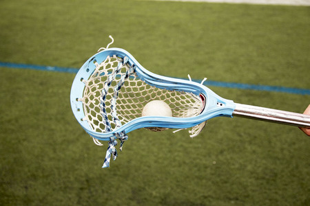 Carolina blue lacrosse stick carrying a ballの写真素材