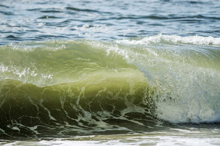 A wave forming a nice curl in the Ocean off of Long Island, NYの写真素材