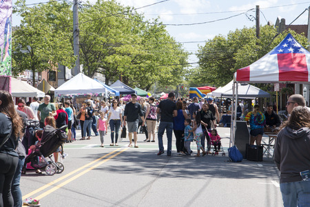 Babylon, New York, USA - 3 June 2017: People enjoying the annual Babylon Village street fair on Deer Park Ave, with lots of vendors, rides and food.のeditorial素材