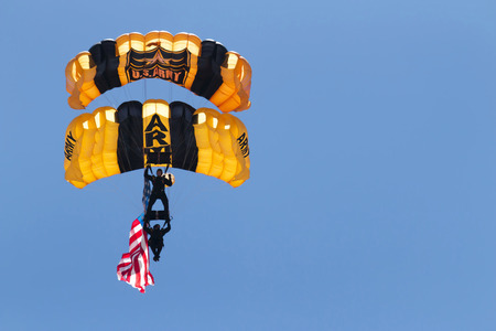 Wantagh, NY, United States - 26 May 2017: US Army paratroopers carying the american flag open up the practice show for the air show that was to be held the next two days during memorial day weekend at Jones Beach, NY.のeditorial素材