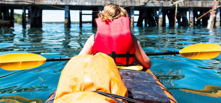 Picture from passanger of a two person kayak of the front rower from behind and looking at where the boat is going in Bar Harbor Maine.の写真素材