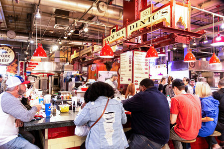 Philadelphia, Pennsylvania USA - 26 April 2019: The inside of Reading Market at lunch time with a...