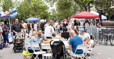Babylon, New York, USA - 1 June 2019: People enjoying the Babylon spring fling shopping from vendors and eating at tables on the road.のeditorial素材