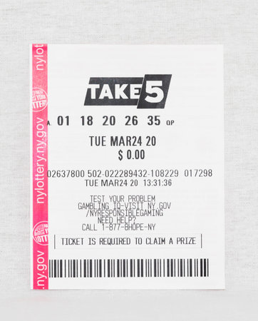 Babylon, New York, 11 April 2020: Losing take 5 lottery ticket from March 24 2020 with a white...