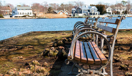 Three park benches side by side overlooking the connetquot river in the Bayard cuttting arboretum.の写真素材