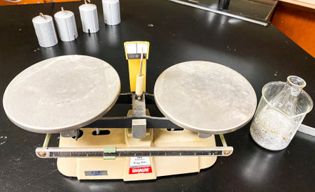 West Islip, New York, USA - 30 November 2020: View from above of a high school science lab table with a scale for measuring experiments.のeditorial素材