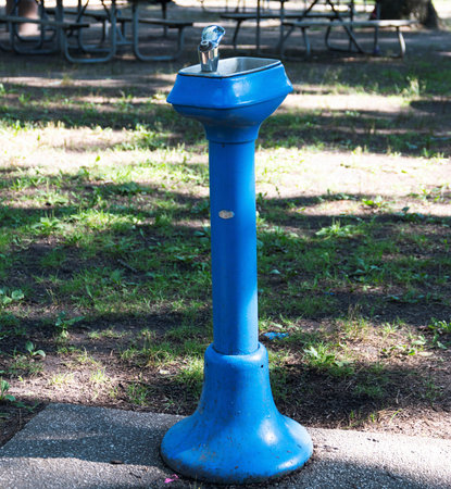 Vertical view of an old blue public water fountain in Belmont Lake State Park.の写真素材