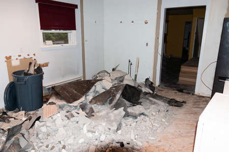 Plies of tile and bare walls of a residential kitchen at the start of construction of a new kitchen being installed.の写真素材