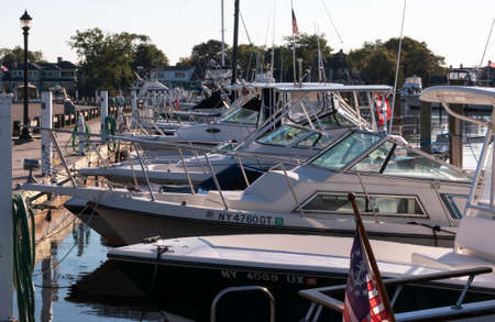 Babylon, New York, USA - 7 September 2021: Side view of many boats tied up and docked in a marina in Babylon Village close up.のeditorial素材