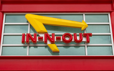 Los Angeles, California, USA - 15 May 2022: Logo of an In-N-Out burger on the entrance of a stand...