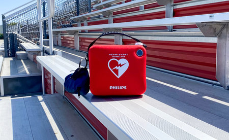 West Islip, New York, USA - 17 May 2023: A life saving AED difibrillator in the bleachers for the...