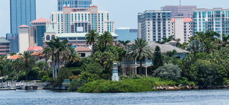 Florida - USA - 28 July 2018: A body of water with palm trees and buildings in the backgroundのeditorial素材