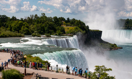 Niagara, New York, USA - 1 August 2023: A group of people standing at the base of the waterfalls in Niagara Falls New York State Park.のeditorial素材