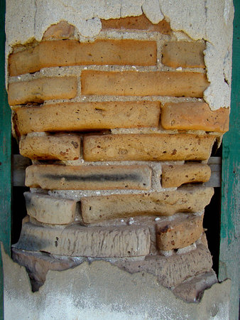 Old weathered brick wall from time immemorialの写真素材