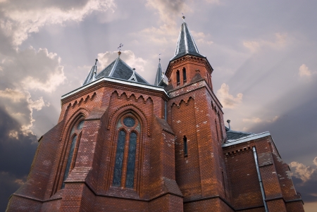 Brick church in sunriseの写真素材