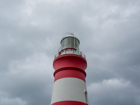 The historic red and white lighthouse at Cape Alguhas at the southernmost tip of Africa taken on the 11.10.2016の写真素材