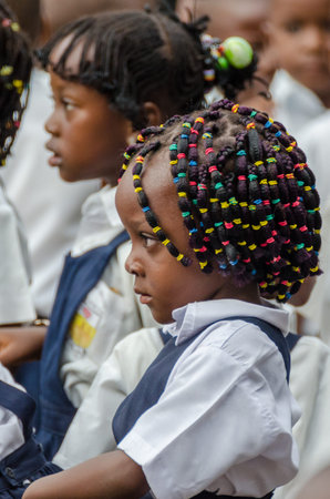 Young African school girl with beautifully decorated hair at pre-school in Matadi, Congo, Central Africaのeditorial素材