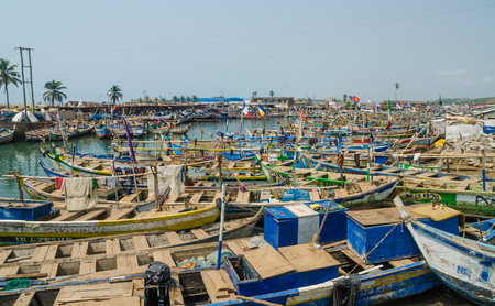 Elmina, Ghana - February 13, 2014: Colorful moored wooden fishing boats in African harbor town Elminaのeditorial素材