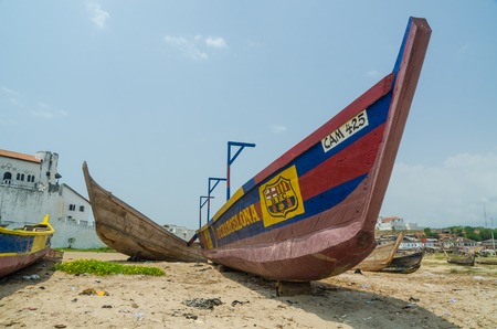 Elmina, Ghana - February 13, 2014: Wooden fishing boat on beach painted with FC Barcelona football club coloursのeditorial素材