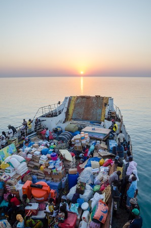 Bissau, Guinea Bissau - December 06, 2013: Old ferry heavily loaded on journey to Bubaque from Bissau, Bijagos Islandsのeditorial素材